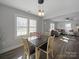 Bright dining area featuring an open layout connecting to the living room and ample natural light at 407 E Talleyrand St, Monroe, NC 28112