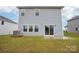 Rear view of a home highlighting a small patio and central AC unit at 410 Luna Ln, Shelby, NC 28152
