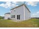 Back exterior of home featuring sliding glass doors opening onto a small concrete patio at 410 Luna Ln, Shelby, NC 28152