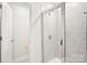 Close-up of bathroom with tiled shower and glass door, complemented by sleek fixtures at 410 Luna Ln, Shelby, NC 28152