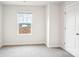 Light and airy bedroom with neutral walls, carpeted floors, and a window with neighborhood views at 410 Luna Ln, Shelby, NC 28152