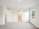 Bright bedroom with neutral walls and carpet, multiple doorways and one window at 410 Luna Ln, Shelby, NC 28152
