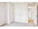This bedroom features neutral carpeting, a white door and plenty of wall space at 410 Luna Ln, Shelby, NC 28152
