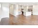 Spacious living area showcasing sleek laminate flooring and an open floor plan to the kitchen at 410 Luna Ln, Shelby, NC 28152
