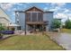 Expansive backyard featuring a large screened porch and patio area, perfect for outdoor living at 4660 Ardmore Ln, Harrisburg, NC 28075
