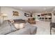 Spacious finished basement with a large sectional sofa and a bar area at 4660 Ardmore Ln, Harrisburg, NC 28075