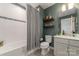 Cozy bathroom featuring a shower/tub combination and decorative shelves at 4660 Ardmore Ln, Harrisburg, NC 28075
