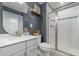 Contemporary bathroom with a glass-enclosed shower, modern vanity, and stylish fixtures, creating a spa-like retreat at 4660 Ardmore Ln, Harrisburg, NC 28075