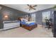 Comfortable bedroom with a ceiling fan, a large window, and a functional desk at 4660 Ardmore Ln, Harrisburg, NC 28075