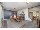 Inviting dining room featuring a wooden table, stylish chairs, and a charming display cabinet at 4660 Ardmore Ln, Harrisburg, NC 28075