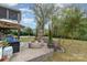 Outdoor patio featuring a stone fire pit and lounge area, perfect for entertaining and relaxing in the backyard at 4660 Ardmore Ln, Harrisburg, NC 28075