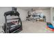 Well-equipped home gym with a treadmill, weight rack, and mirrored wall for workouts at 4660 Ardmore Ln, Harrisburg, NC 28075