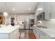 Modern kitchen with stainless steel appliances, gas range, and ample cabinet space, ideal for culinary enthusiasts at 4660 Ardmore Ln, Harrisburg, NC 28075