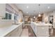 Bright, open kitchen features a large island, modern appliances, and hardwood flooring, perfect for cooking and entertaining at 4660 Ardmore Ln, Harrisburg, NC 28075