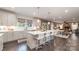 Spacious kitchen with a large island, stainless steel appliances, and an open layout to the dining and living areas at 4660 Ardmore Ln, Harrisburg, NC 28075