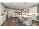 Modern kitchen with a center island, stainless steel appliances, and ample cabinet space, perfect for cooking and entertaining at 4660 Ardmore Ln, Harrisburg, NC 28075