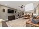 Inviting living room with plush sofas, hardwood floors, and a view into the open kitchen area for seamless entertaining at 4660 Ardmore Ln, Harrisburg, NC 28075