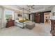 Bright main bedroom featuring a canopy bed, an ensuite bath, and a walk-in closet at 4660 Ardmore Ln, Harrisburg, NC 28075