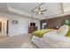 Inviting main bedroom featuring a canopy bed, tray ceiling, and ensuite bath at 4660 Ardmore Ln, Harrisburg, NC 28075