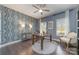 Stylish office space with decorative wallpaper, hardwood floors, and ample natural light, perfect for remote work or study at 4660 Ardmore Ln, Harrisburg, NC 28075