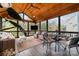 Relaxing sunroom with wood ceiling, large windows, and comfortable seating at 4660 Ardmore Ln, Harrisburg, NC 28075