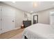 This bedroom features hardwood floors, a dresser and decorative lighting fixture at 4820 Valley Stream Rd, Charlotte, NC 28209
