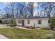 Beautifully renovated home featuring a classic design, manicured landscaping, and welcoming entrance at 4820 Valley Stream Rd, Charlotte, NC 28209