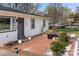 Charming entrance with brick patio, seating, and beautiful landscaping for outdoor enjoyment at 4820 Valley Stream Rd, Charlotte, NC 28209