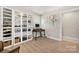 This office features a large window, a computer desk and a large shelving unit at 4820 Valley Stream Rd, Charlotte, NC 28209