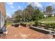 Brick patio featuring an outdoor seating area and manicured landscaping for outdoor enjoyment at 4820 Valley Stream Rd, Charlotte, NC 28209