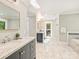 Large bathroom features updated vanity, shower, soaking tub, and natural light at 4830 Broad Hollow Dr, Charlotte, NC 28226