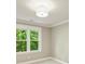 Bedroom featuring neutral paint, two windows and plush carpeting at 4830 Broad Hollow Dr, Charlotte, NC 28226