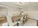 Well-appointed dining room featuring a contemporary chandelier and seating for eight people at 4830 Broad Hollow Dr, Charlotte, NC 28226