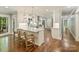 Open-concept kitchen boasts a large island, stainless steel appliances, and hardwood floors at 4830 Broad Hollow Dr, Charlotte, NC 28226