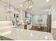 Bright kitchen features white cabinetry, granite countertops, stainless appliances and eat-in dining at 4830 Broad Hollow Dr, Charlotte, NC 28226