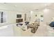 A living room with a wet bar, comfortable seating, and a TV for entertainment at 4830 Broad Hollow Dr, Charlotte, NC 28226