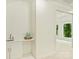 This wet bar has white cabinets and a sink at 4830 Broad Hollow Dr, Charlotte, NC 28226