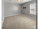 Neutral bedroom with carpet, window, and minimalist design, offering a blank canvas for personalization at 4906 Lynn Lee Cir, Charlotte, NC 28269