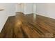 Open-concept living area featuring gleaming hardwood floors, creating a seamless flow throughout the home at 4906 Lynn Lee Cir, Charlotte, NC 28269