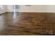 Spacious living room featuring gleaming hardwood floors and a neutral color palette at 4906 Lynn Lee Cir, Charlotte, NC 28269