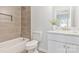 This bathroom features a tiled shower and tub combo, toilet, and modern sink at 511 Roberts St, Shelby, NC 28150