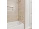 Modern bathroom featuring a tiled shower and tub combo with stylish fixtures and neutral tones at 511 Roberts St, Shelby, NC 28150