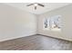 Bright bedroom featuring wood-look flooring, a ceiling fan, and windows offering plenty of natural light at 511 Roberts St, Shelby, NC 28150