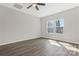 Bright bedroom offers ample space, natural light, and modern ceiling fan at 511 Roberts St, Shelby, NC 28150