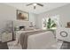 Cozy bedroom with windows, natural light, decorative touches, and a ceiling fan at 511 Roberts St, Shelby, NC 28150