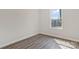 This bedroom features wood-look floors and a window providing natural light at 511 Roberts St, Shelby, NC 28150