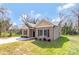 Charming single-story home featuring neutral siding, black shutters, and a well-maintained front yard with a concrete driveway at 511 Roberts St, Shelby, NC 28150