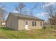 View of the back of the home, showing the siding and small back porch at 511 Roberts St, Shelby, NC 28150