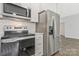 Kitchen offers stainless steel appliances, white cabinets, and subway tile backsplash at 511 Roberts St, Shelby, NC 28150