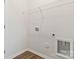 Laundry room with wire shelving, washer and dryer hookups, and utility connections at 511 Roberts St, Shelby, NC 28150